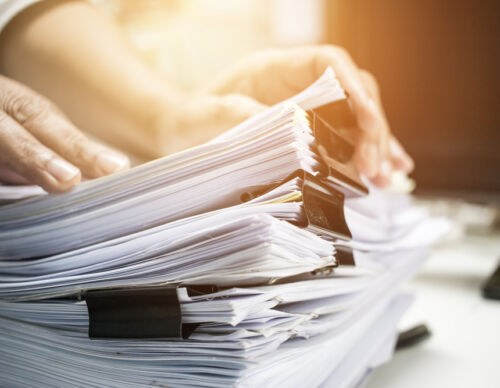 Work,From,Home,,Businessman,Hands,Working,In,Stacks,Of,Paper